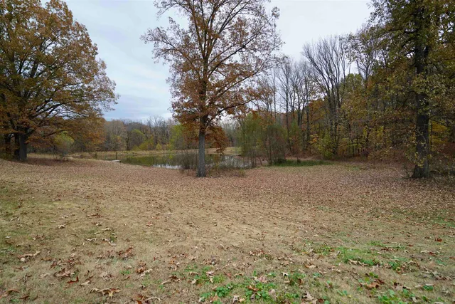 a aerial view of a house with a yard