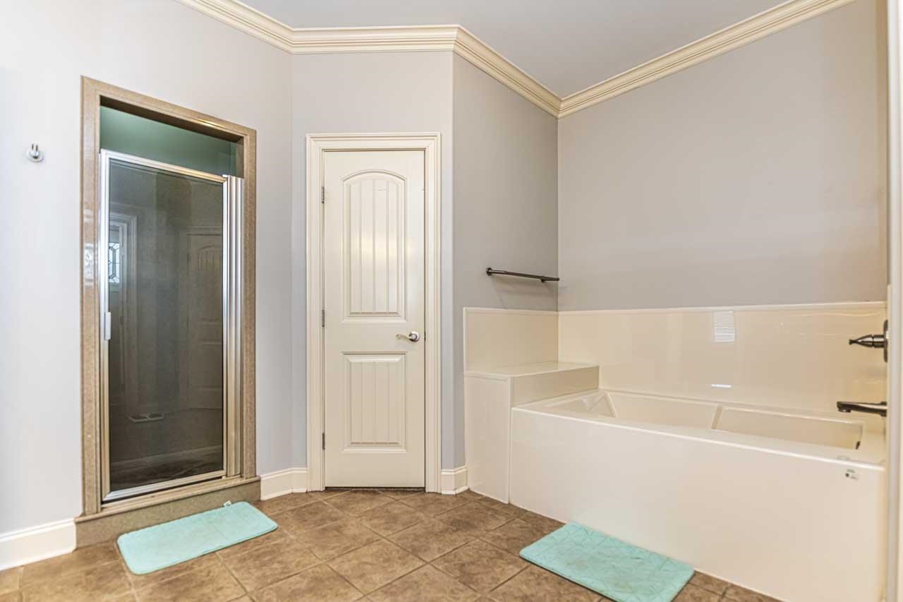 516 Egypt Road Munford, TN 38058 - Photo 21 of 40 a bathroom with a bathtub and shower