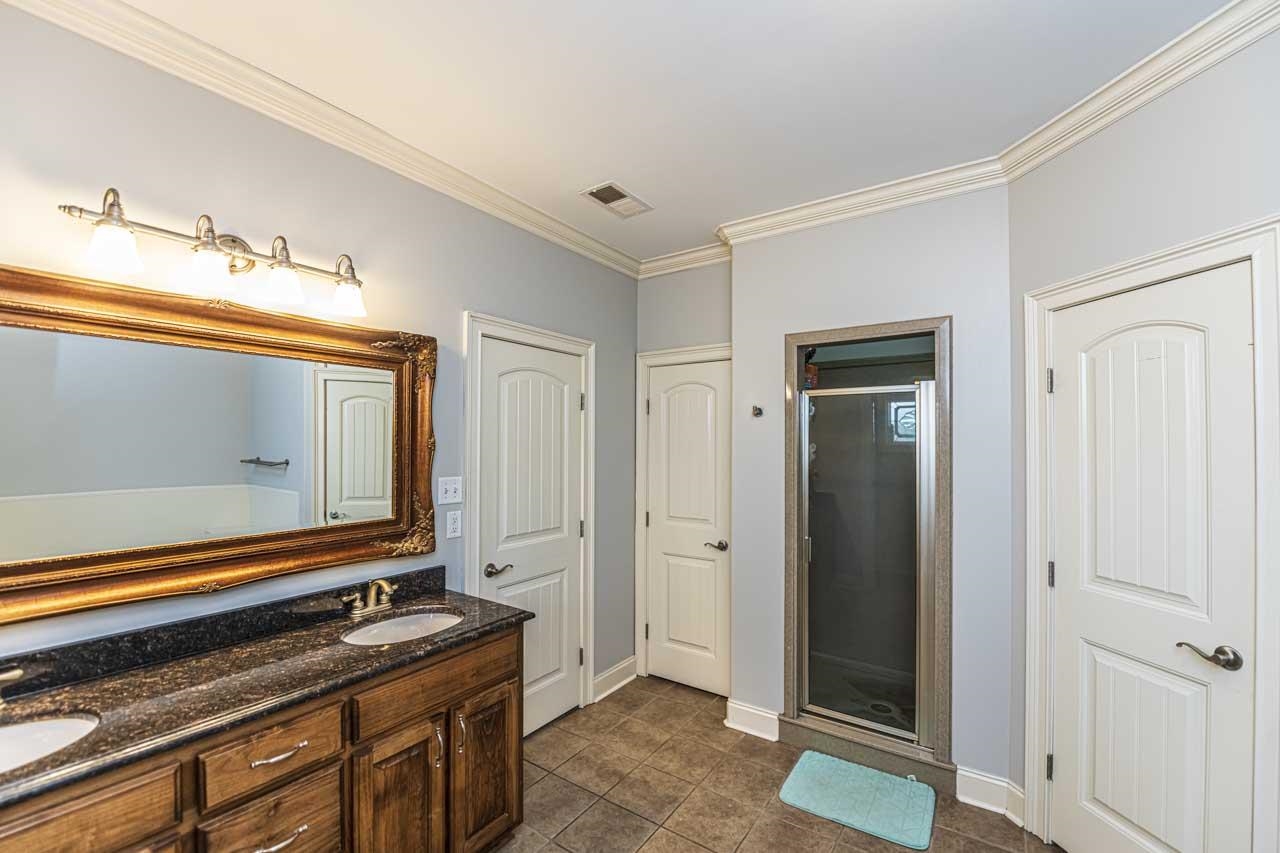 516 Egypt Road Munford, TN 38058 - Photo 23 of 40 a bathroom with a sink and a mirror