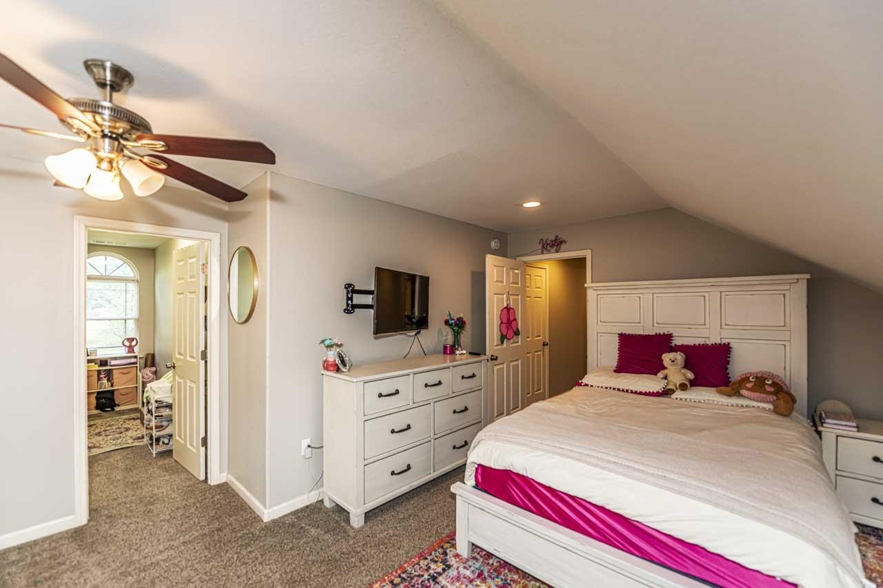 516 Egypt Road Munford, TN 38058 - Photo 26 of 40 a bedroom with a bed and a flat tv screen on dresser