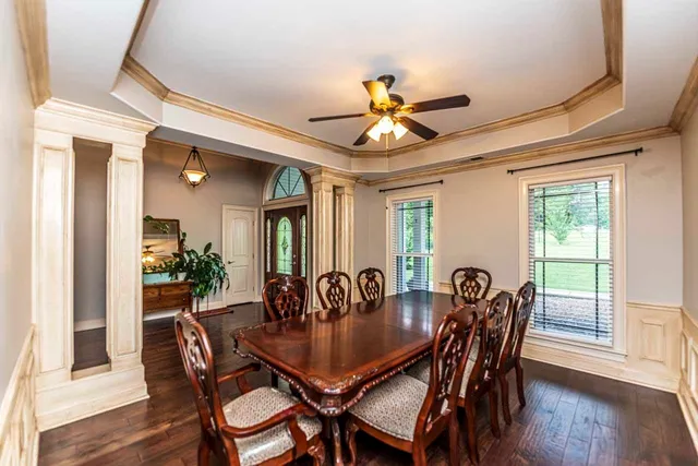 a kitchen with granite countertop a sink and cabinets