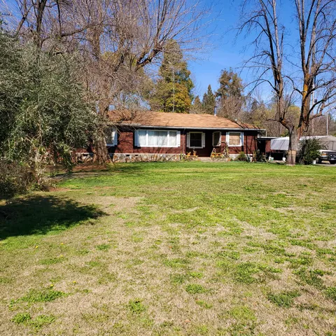 a view of a big yard next to a house