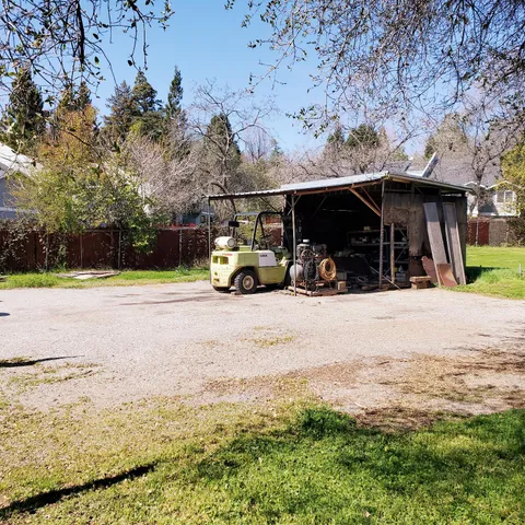 a view of outdoor space with deck and tree