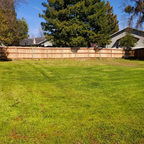a view of a swimming pool and an outdoor space