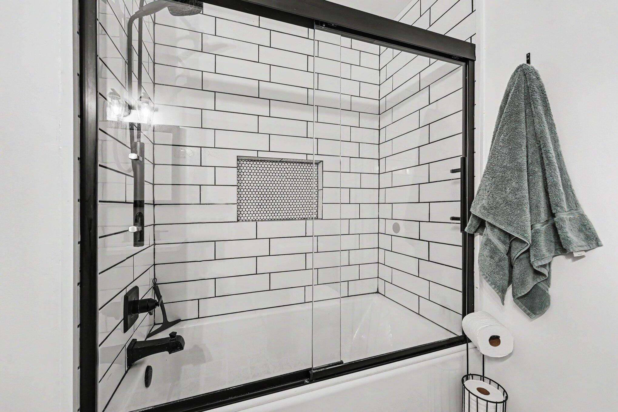 835 North Indiana Street Griffith, IN 46319 - Photo 16 of 19 a bathroom with a bathtub and shower