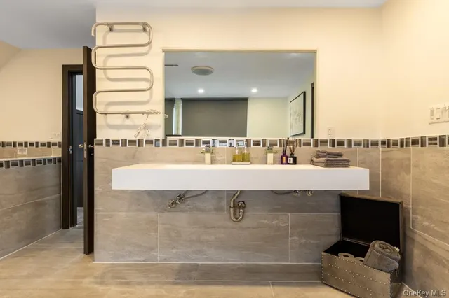 a large bathroom with a large tub and sink