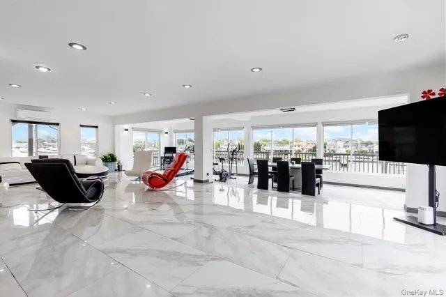 a living room with lots of furniture and white walls