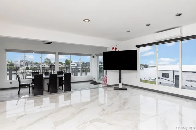 a living room with lots of furniture and a flat screen tv