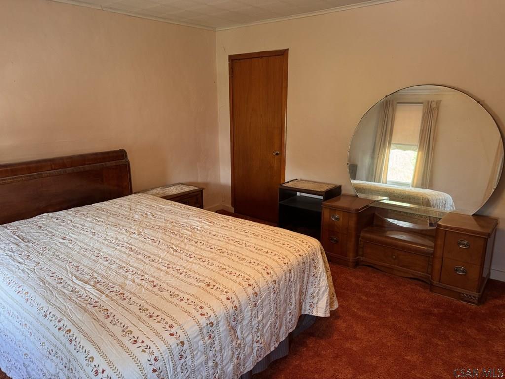 139 Reed Street Elmora, PA 15737 - Photo 19 of 23 a bedroom with a bed and a mirror