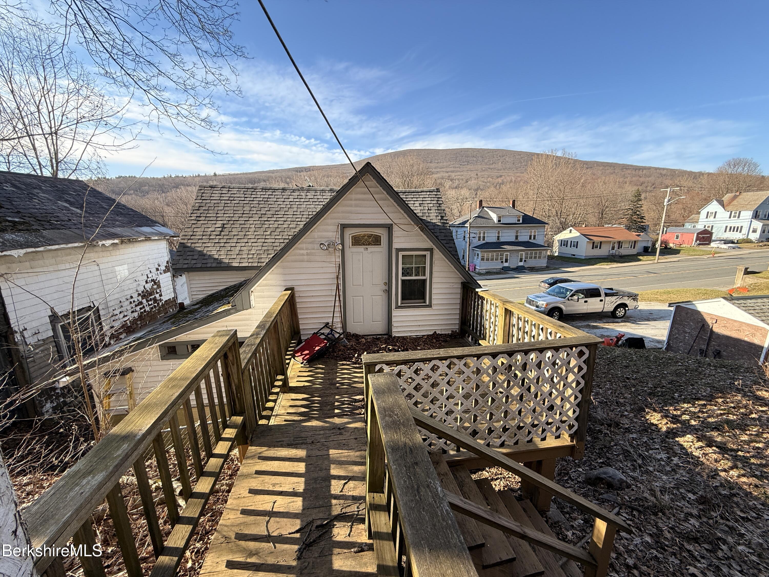 422 West Main Street North Adams, MA 01247 - Photo 15 of 24 a view of a roof deck with wooden floor and city view