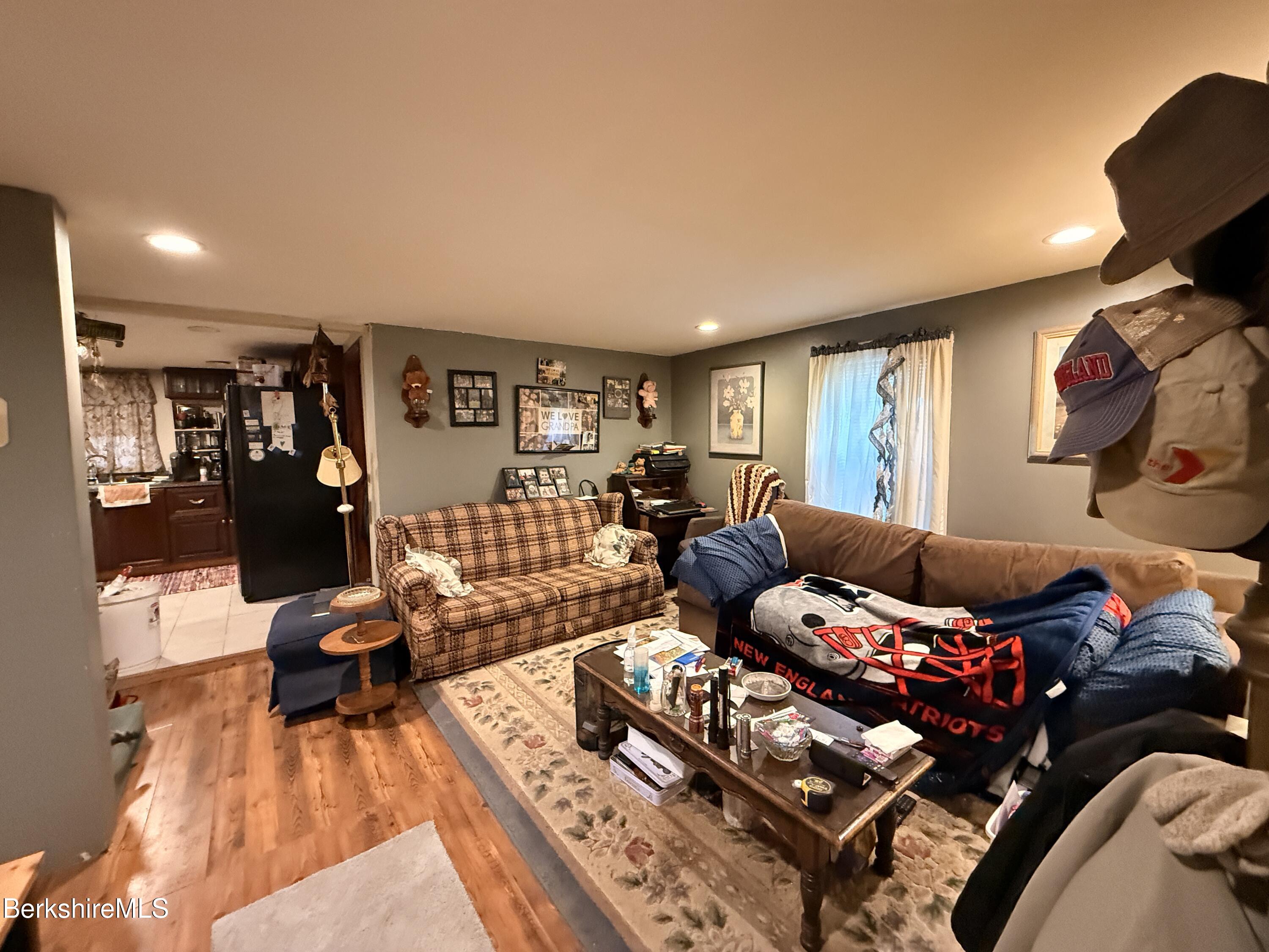 422 West Main Street North Adams, MA 01247 - Photo 7 of 24 a living room with furniture a wooden floor and next to a window