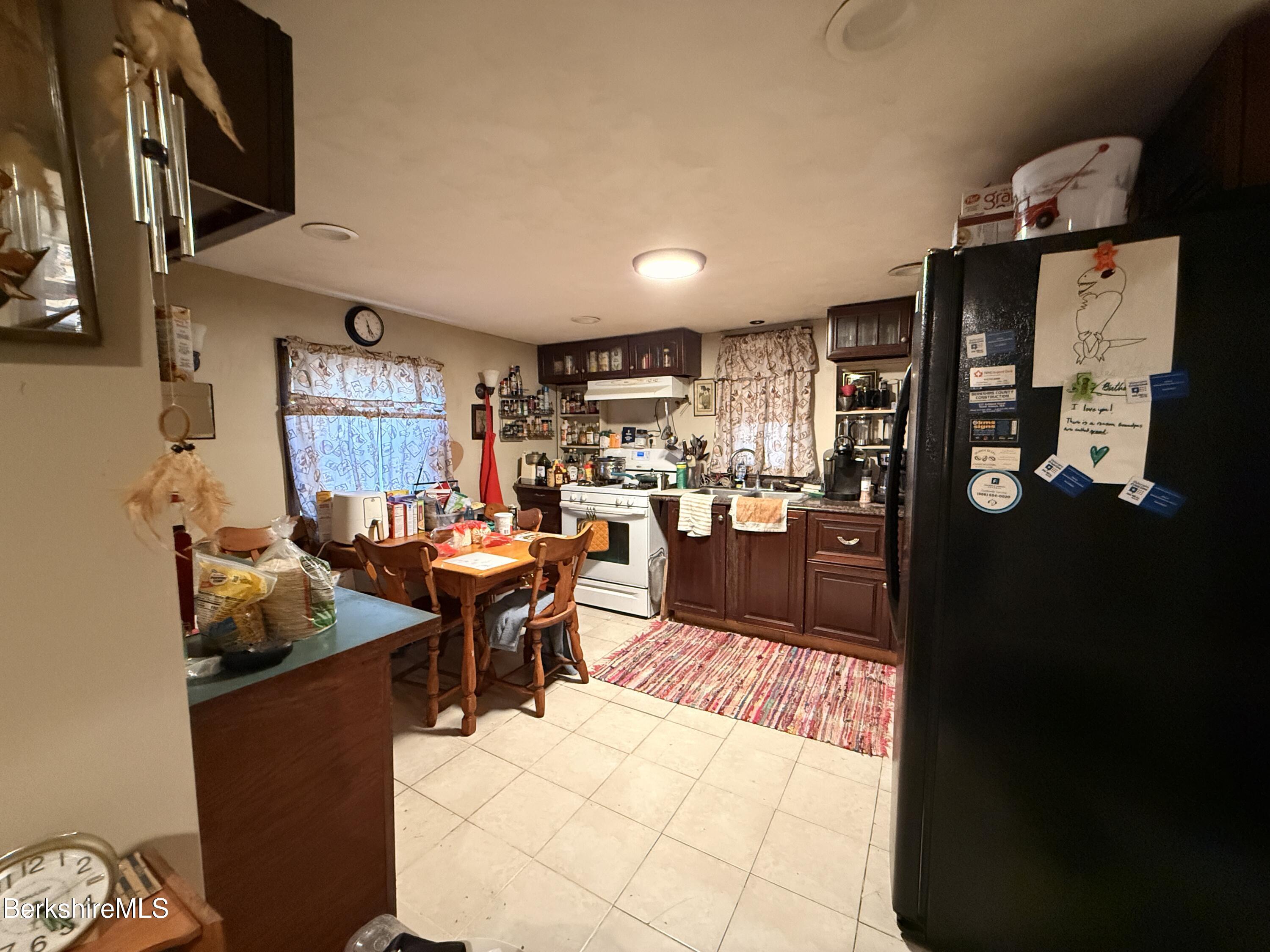 422 West Main Street North Adams, MA 01247 - Photo 8 of 24 a living room with stainless steel appliances kitchen island granite countertop furniture a rug and a view of kitchen