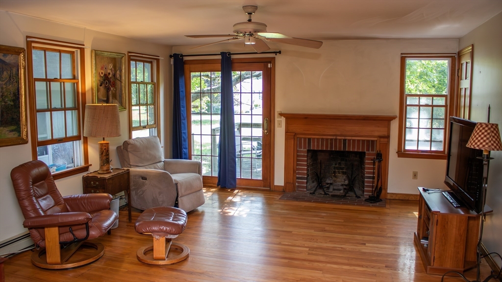 562 North Avenue Rochester, MA 02770 - Photo 11 of 32 a living room with furniture fireplace and flat screen tv