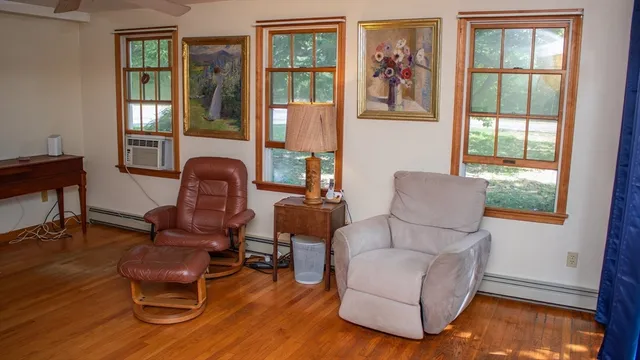 a living room with furniture and a window