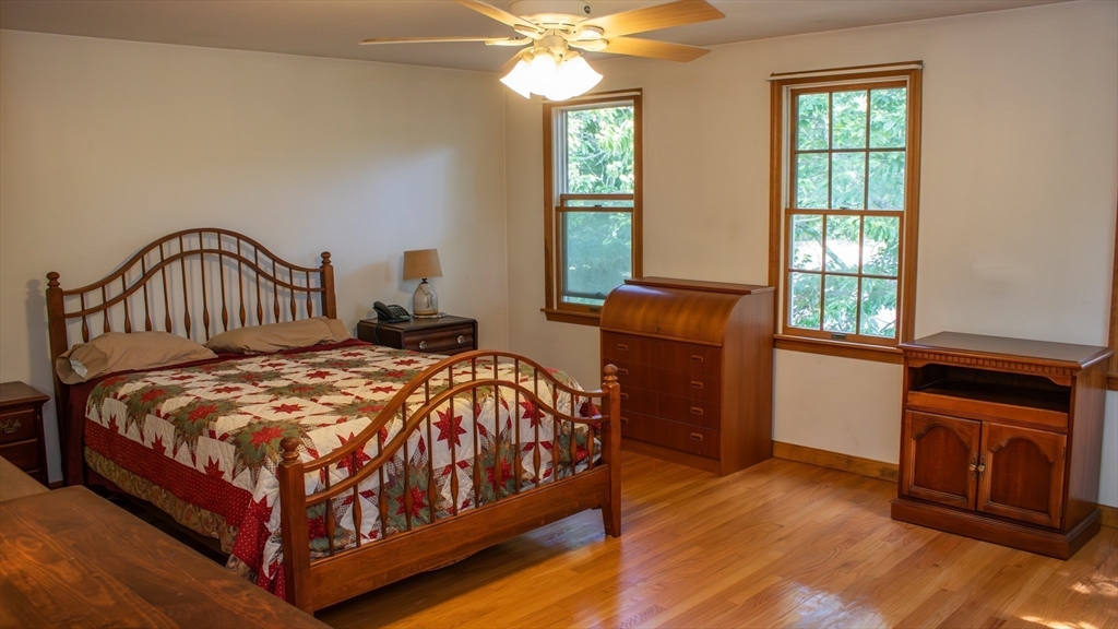 562 North Avenue Rochester, MA 02770 - Photo 17 of 32 a bedroom with a bed and a window