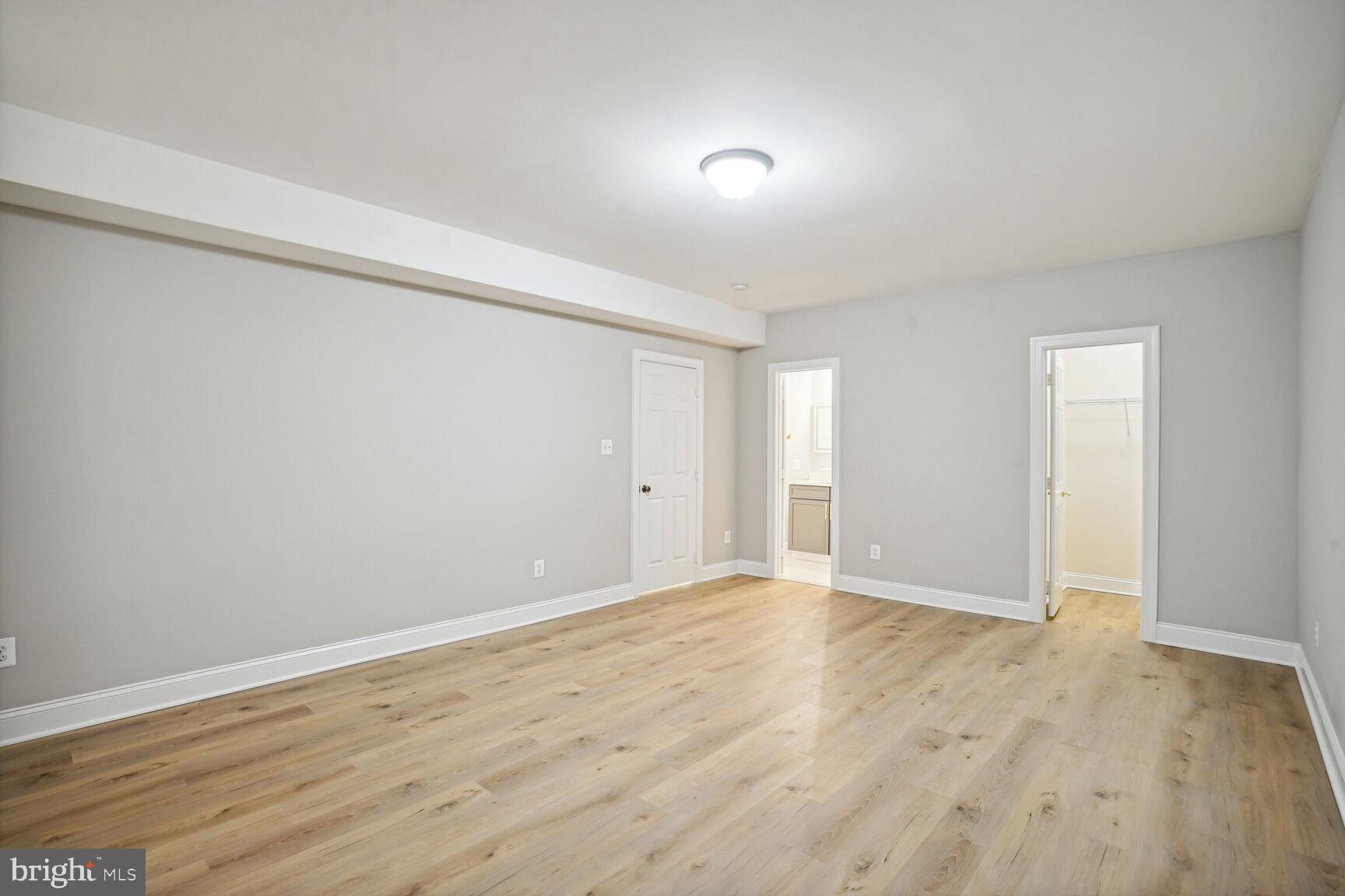 6390 Gayfields Road Alexandria, VA 22315 - Photo 14 of 15 a view of an empty room with wooden floor