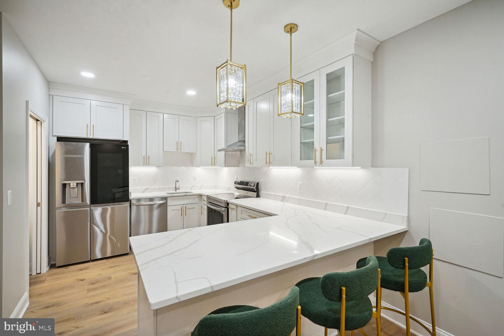 6390 Gayfields Road Alexandria, VA 22315 - Photo 3 of 15 a kitchen with counter top space cabinets and stainless steel appliances