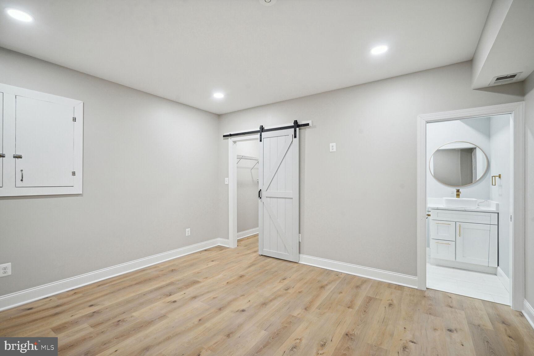 6390 Gayfields Road Alexandria, VA 22315 - Photo 7 of 15 a view of a room with wooden floor and white walls
