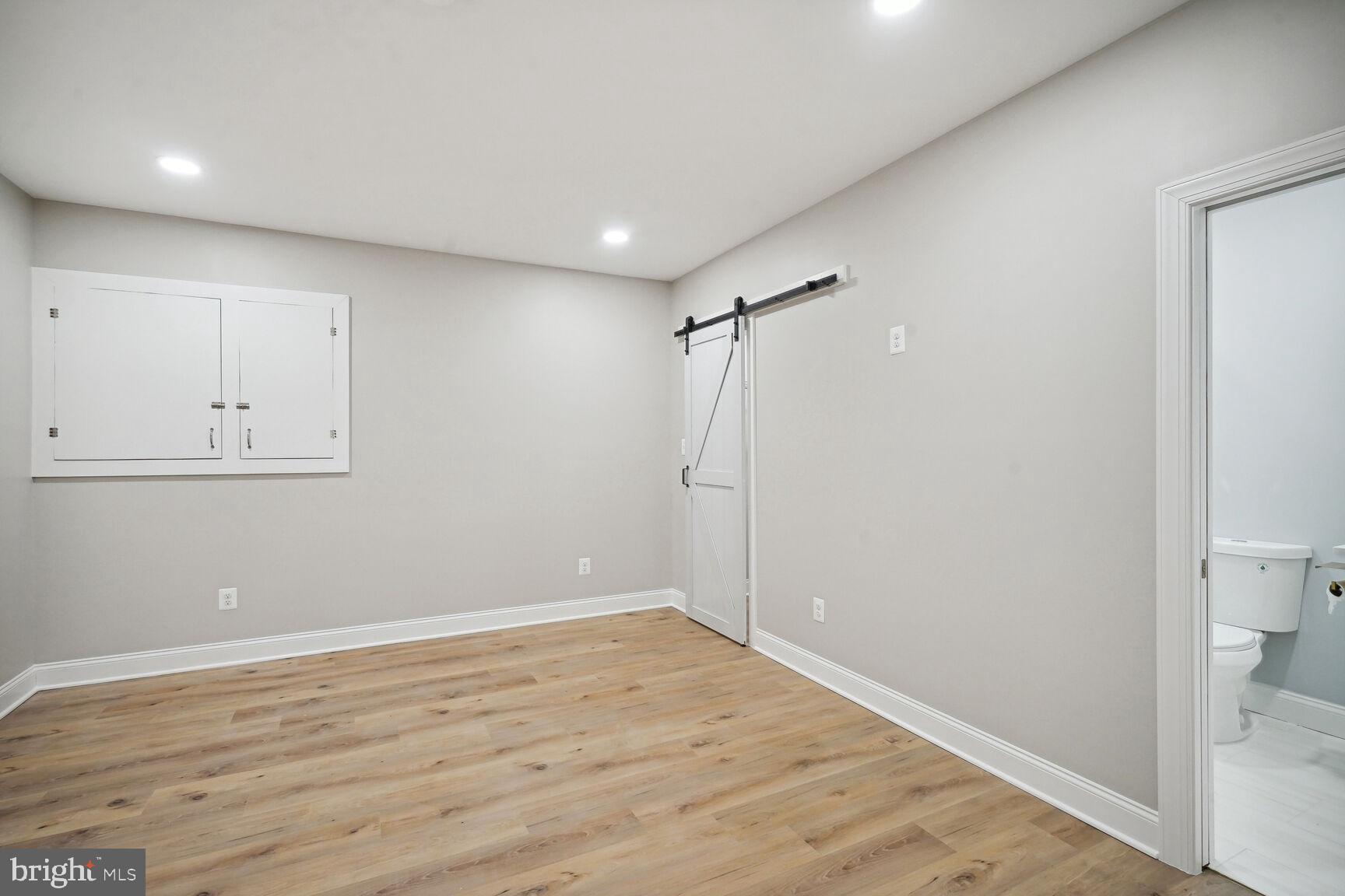 6390 Gayfields Road Alexandria, VA 22315 - Photo 9 of 15 a view of a room with wooden floor and cabinet