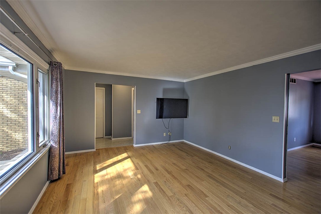 122 Bretton Court Decatur, IL 62521 - Photo 5 of 33 a view of a livingroom with wooden floor and windows