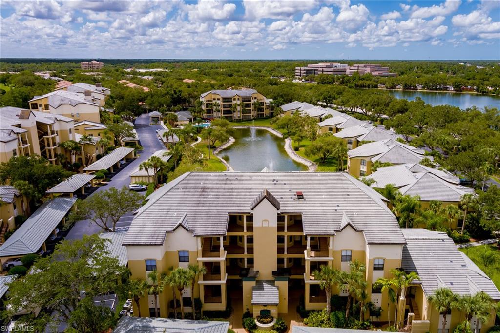195 Vintage Circle, Unit E205 Naples, FL 34119 - Photo 27 of 34 an aerial view of residential houses with outdoor space