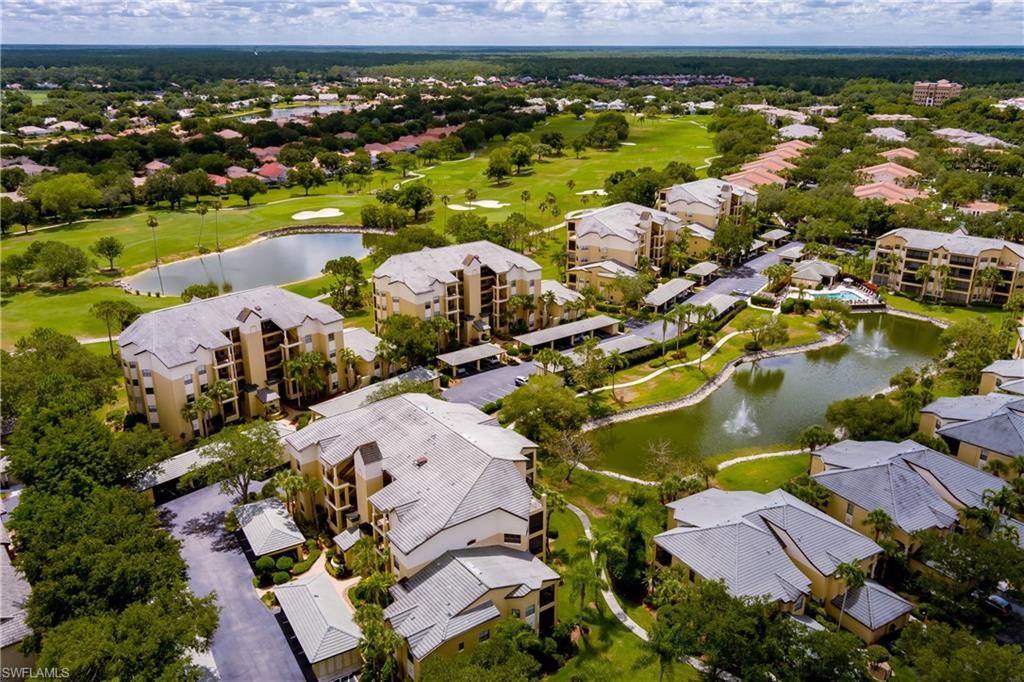 195 Vintage Circle, Unit E205 Naples, FL 34119 - Photo 29 of 34 an aerial view of residential houses with outdoor space