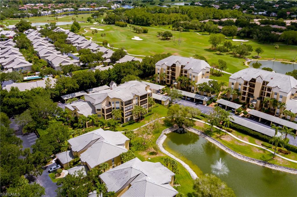 195 Vintage Circle, Unit E205 Naples, FL 34119 - Photo 31 of 34 an aerial view of residential houses with outdoor space and lake view