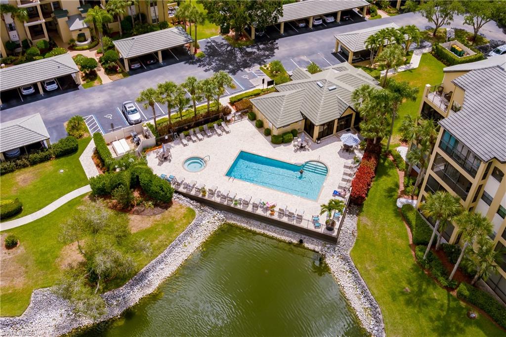 195 Vintage Circle, Unit E205 Naples, FL 34119 - Photo 33 of 34 an aerial view of a house with a swimming pool