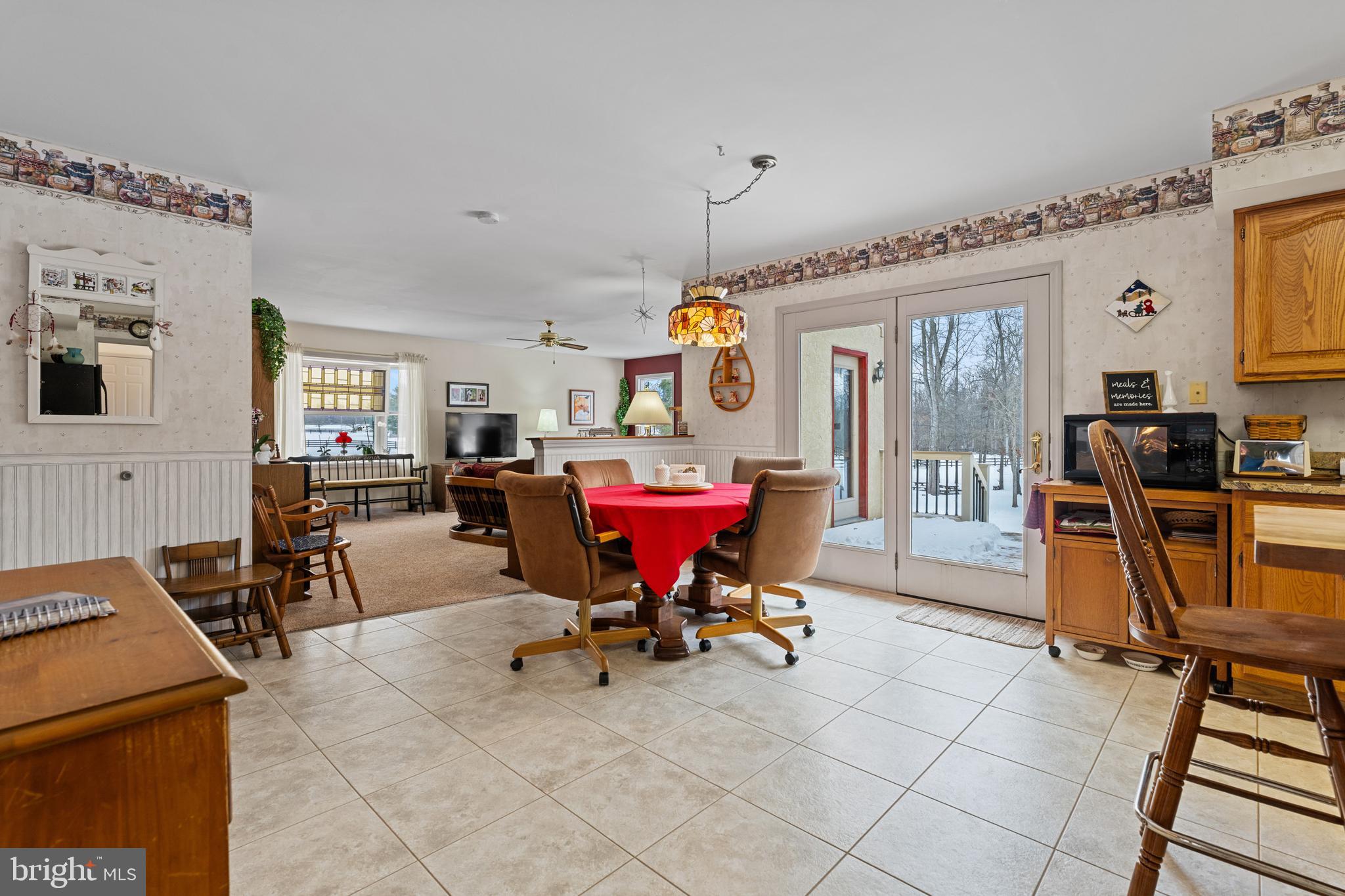 118 Middle Creek Road Gilbertsville, PA 19525 - Photo 20 of 108 a view of a dining room with furniture and a chandelier