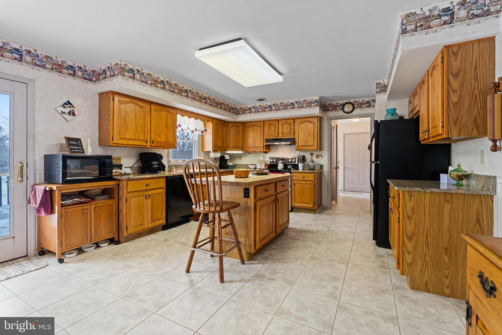 118 Middle Creek Road Gilbertsville, PA 19525 - Photo 21 of 108 a kitchen with stainless steel appliances a stove a sink cabinets and a dining table