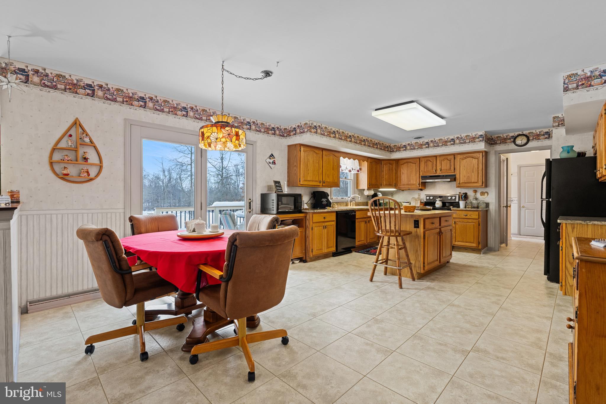 118 Middle Creek Road Gilbertsville, PA 19525 - Photo 22 of 108 a view of a dining room with furniture window and wooden floor