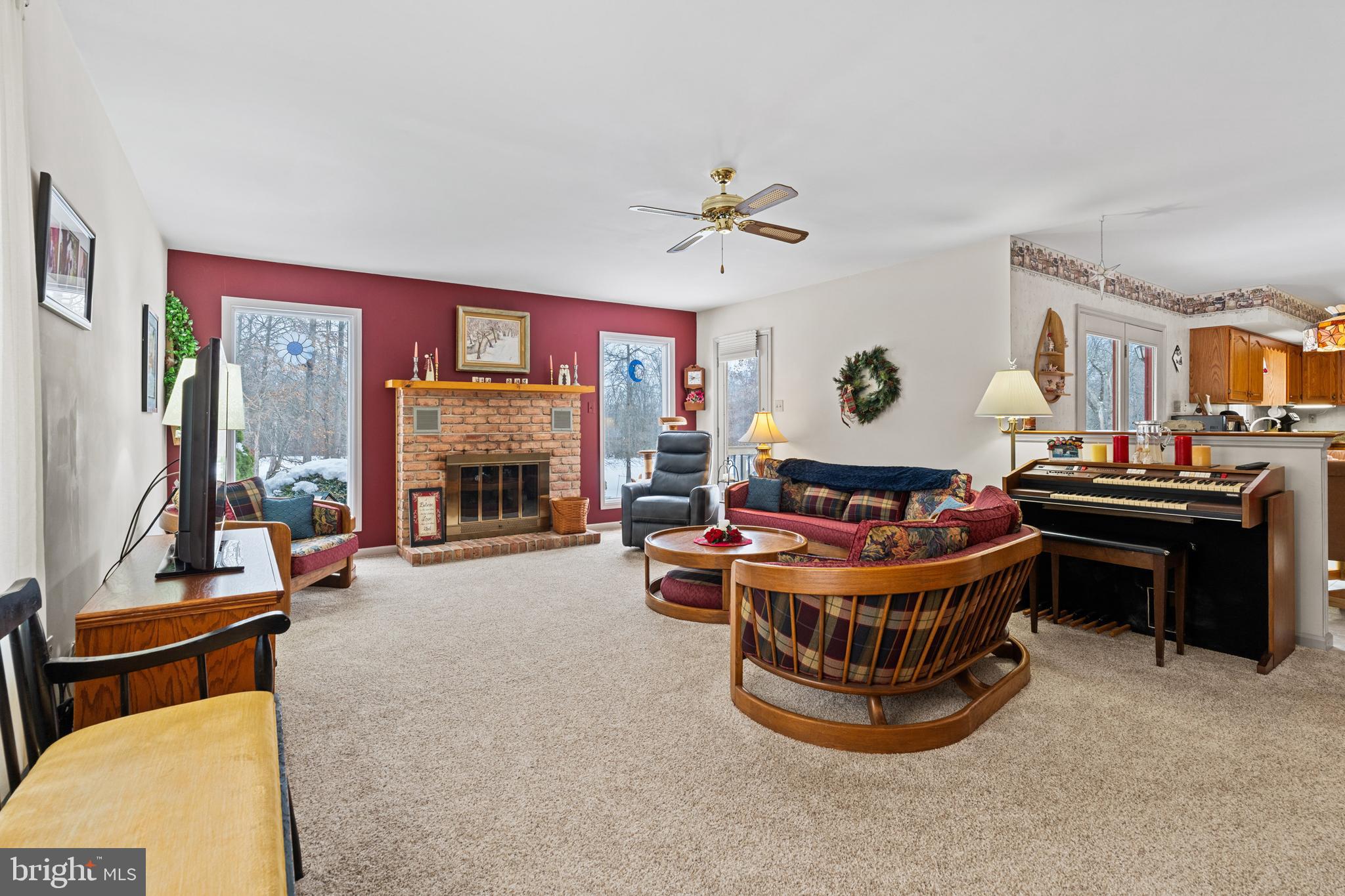 118 Middle Creek Road Gilbertsville, PA 19525 - Photo 30 of 108 a living room with furniture a fireplace and a flat screen tv