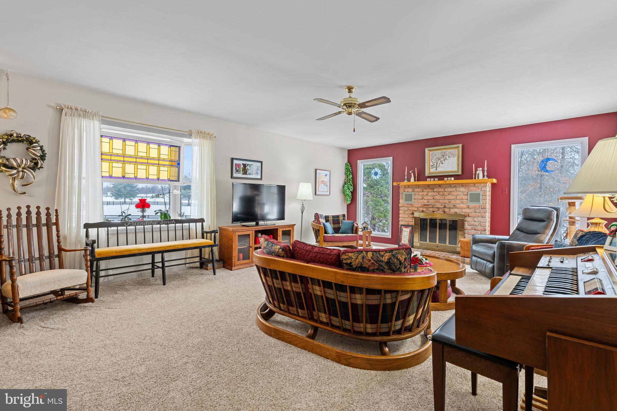 118 Middle Creek Road Gilbertsville, PA 19525 - Photo 34 of 108 a living room with furniture a fireplace and a flat screen tv