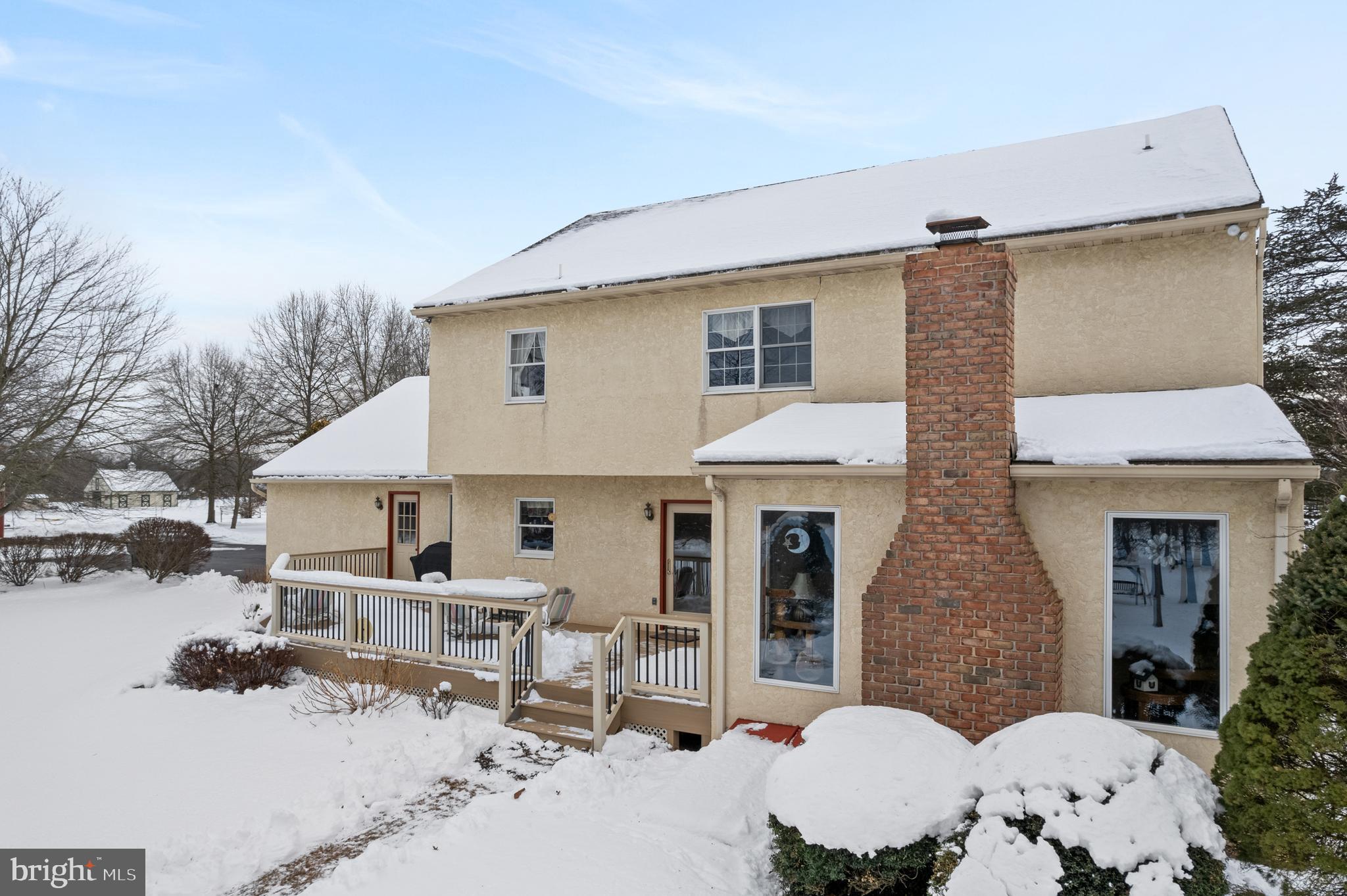 118 Middle Creek Road Gilbertsville, PA 19525 - Photo 81 of 108 a view of a patio with couches and table and chairs and potted plants