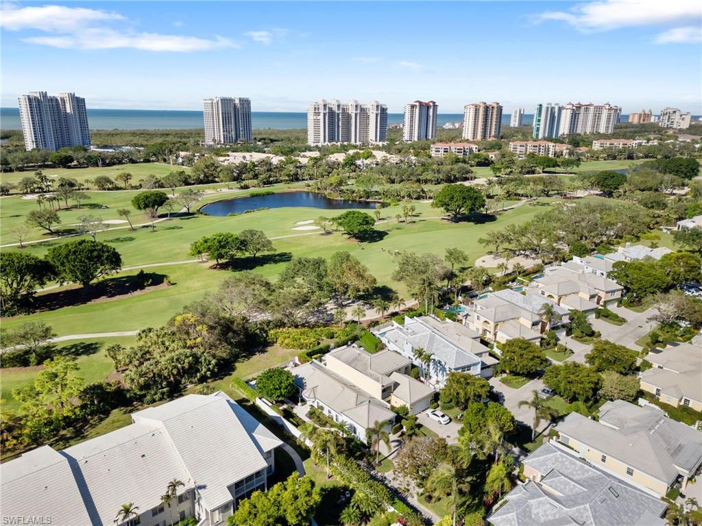 832 Rue Deville, Unit 5 Naples, FL 34108 - Photo 36 of 42 Drone / aerial view featuring a water view