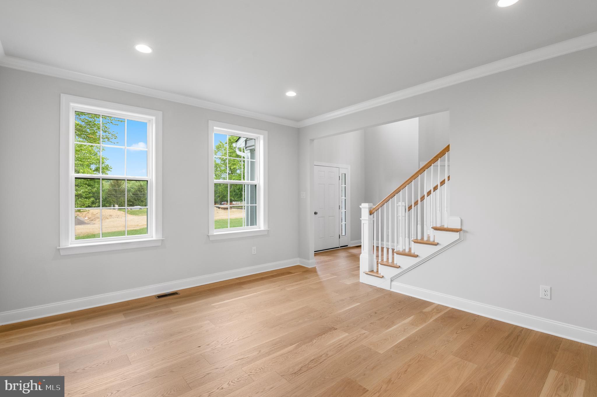 1108 Arden Drive, Unit METHACTON Norristown, PA 19403 - Photo 4 of 27 a view of an empty room with wooden floor and a window