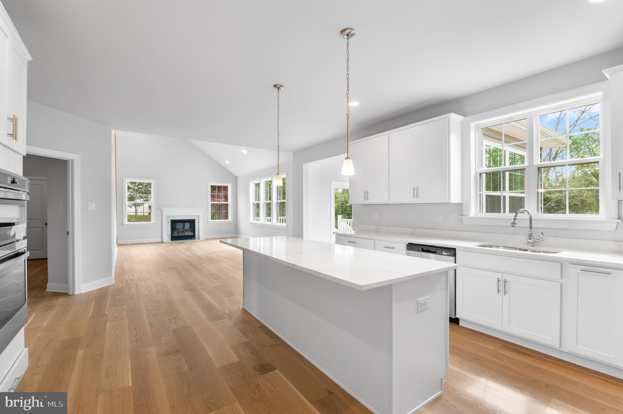 1108 Arden Drive, Unit METHACTON Norristown, PA 19403 - Photo 9 of 27 a large kitchen with kitchen island a sink stainless steel appliances and cabinets