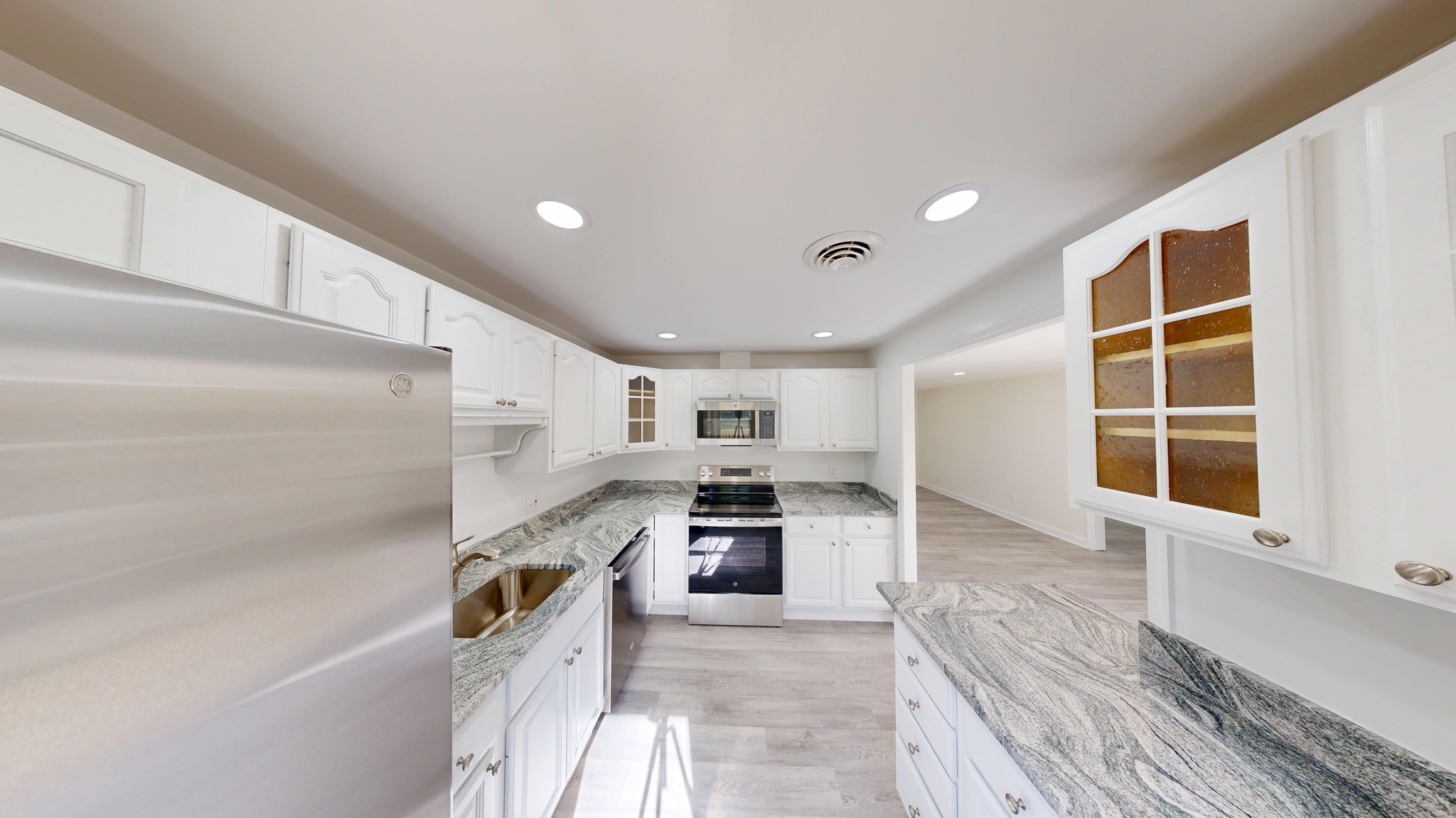 729 West Watersville Road Mount Airy, MD 21771 - Photo 4 of 42 a kitchen with cabinets and wooden floor