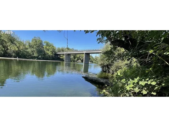 a view of a lake with a street