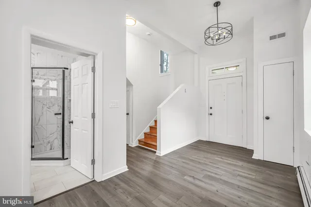 a view of entryway with wooden floor