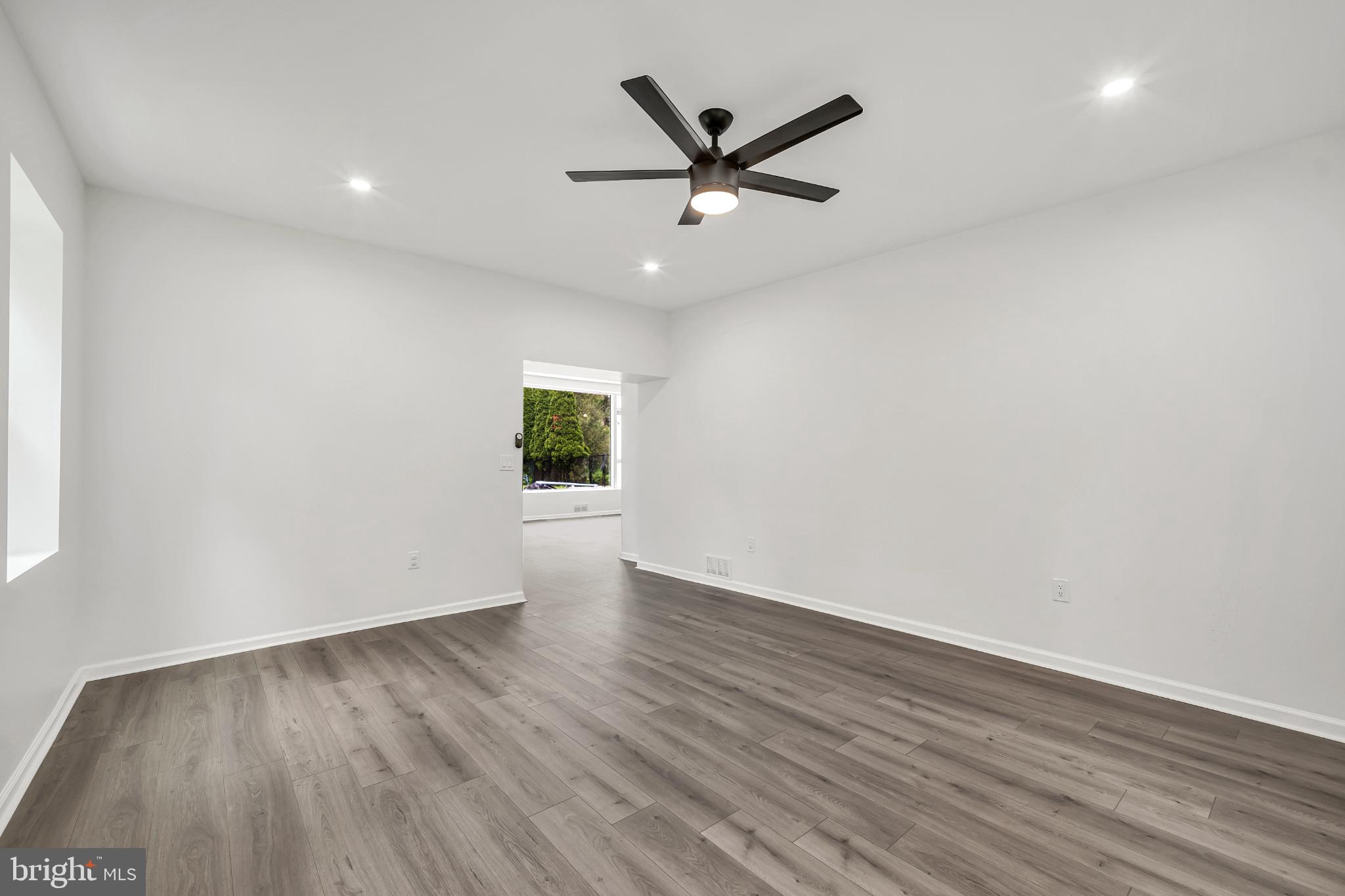 933 Fox Chase Road Jenkintown, PA 19046 - Photo 21 of 39 an empty room with wooden floor and windows