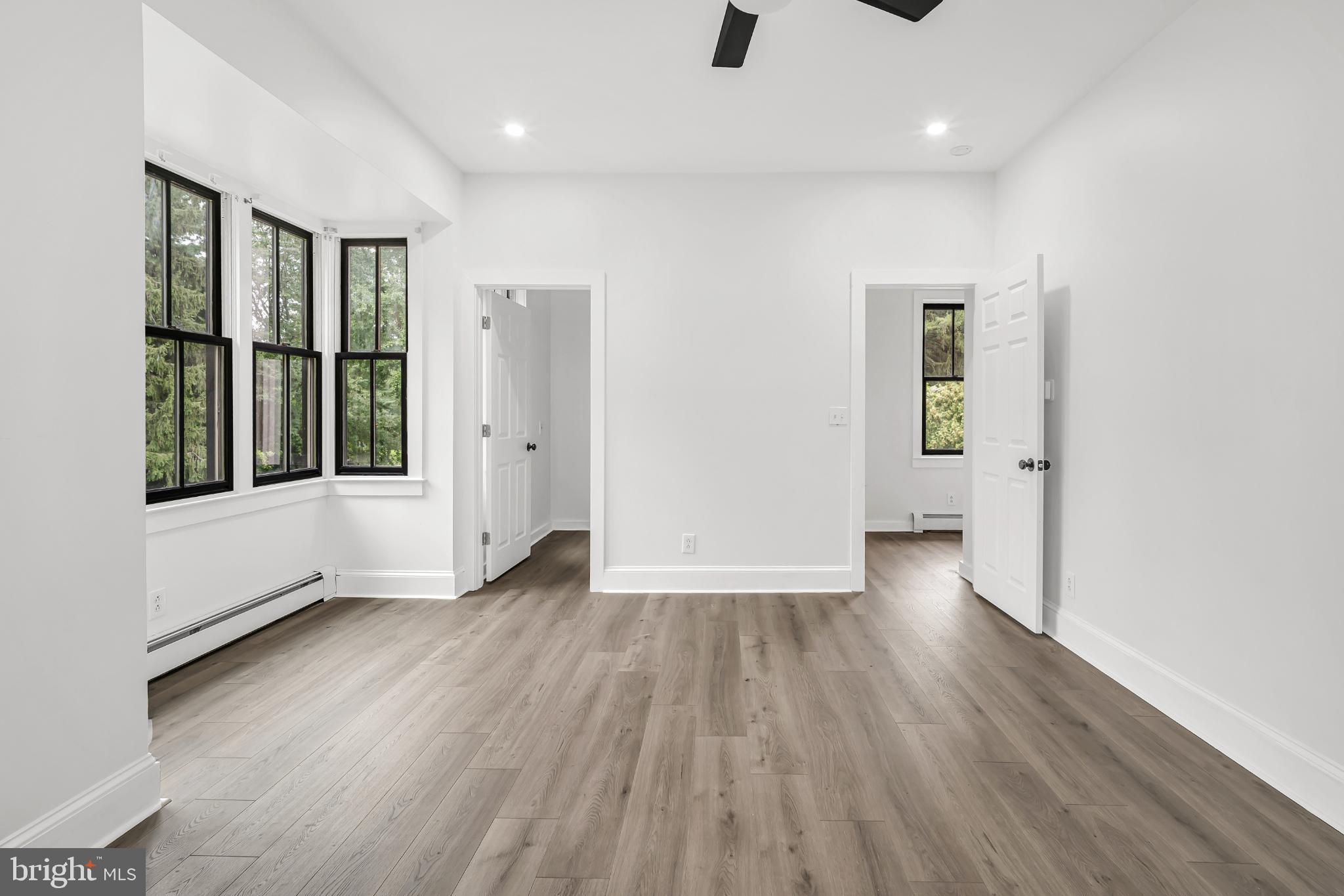 933 Fox Chase Road Jenkintown, PA 19046 - Photo 27 of 39 wooden floor in an empty room with a window