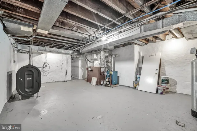 a view of storage and utility room with stairs