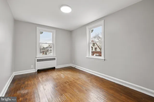 a view of room with wooden floor