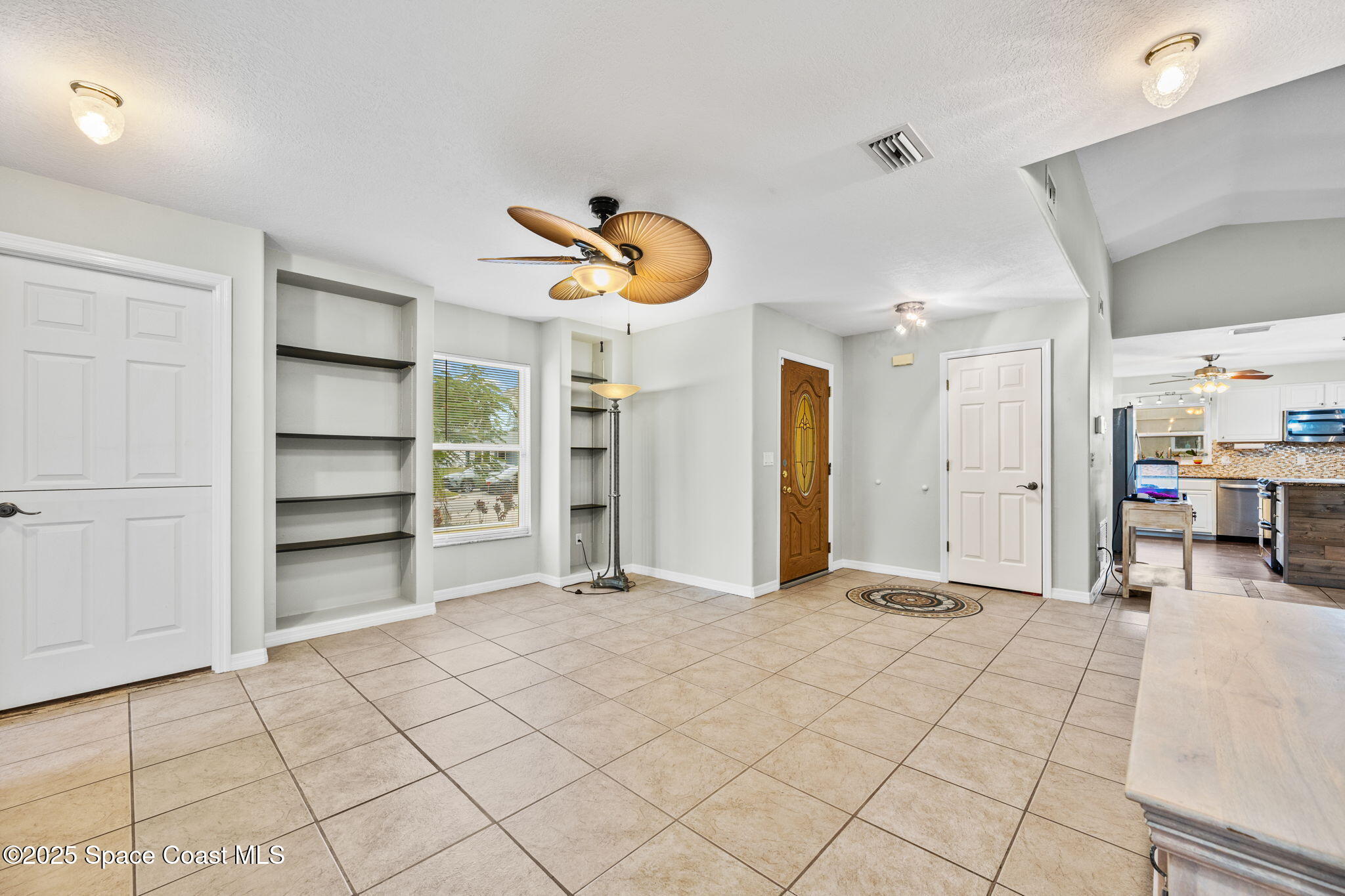 2568 Longwood Boulevard Melbourne, FL 32934 - Photo 13 of 42 a view of a livingroom with furniture and closet