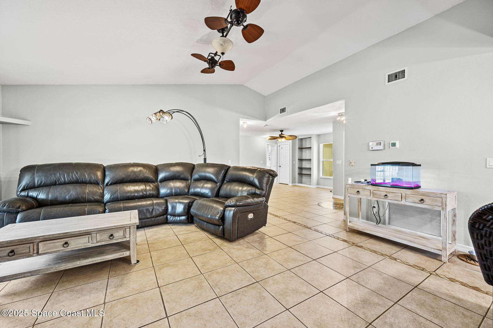 2568 Longwood Boulevard Melbourne, FL 32934 - Photo 23 of 42 a living room with furniture and furniture