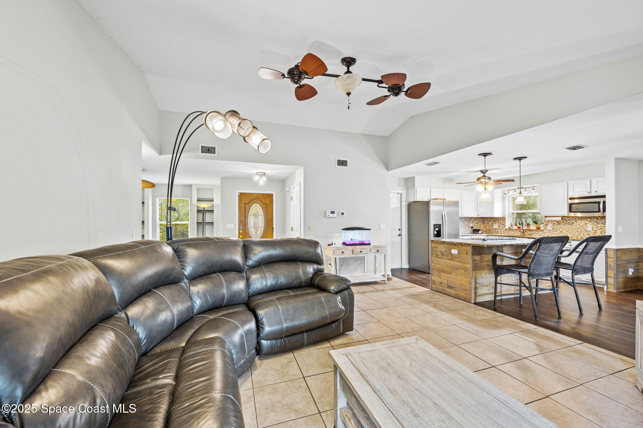 2568 Longwood Boulevard Melbourne, FL 32934 - Photo 24 of 42 a living room with furniture