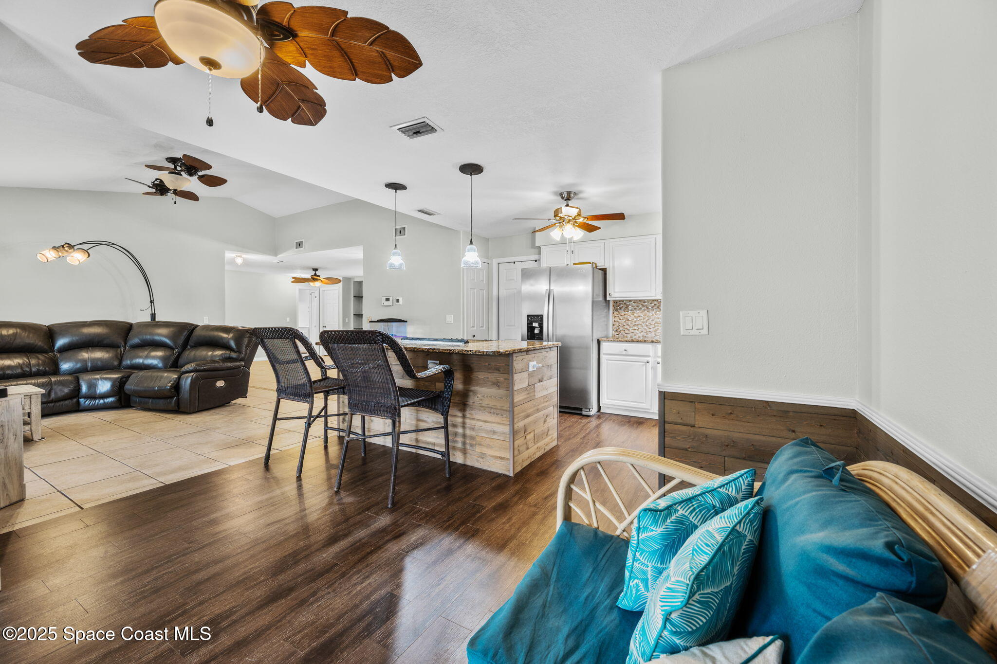 2568 Longwood Boulevard Melbourne, FL 32934 - Photo 30 of 42 a living room with furniture and wooden floor