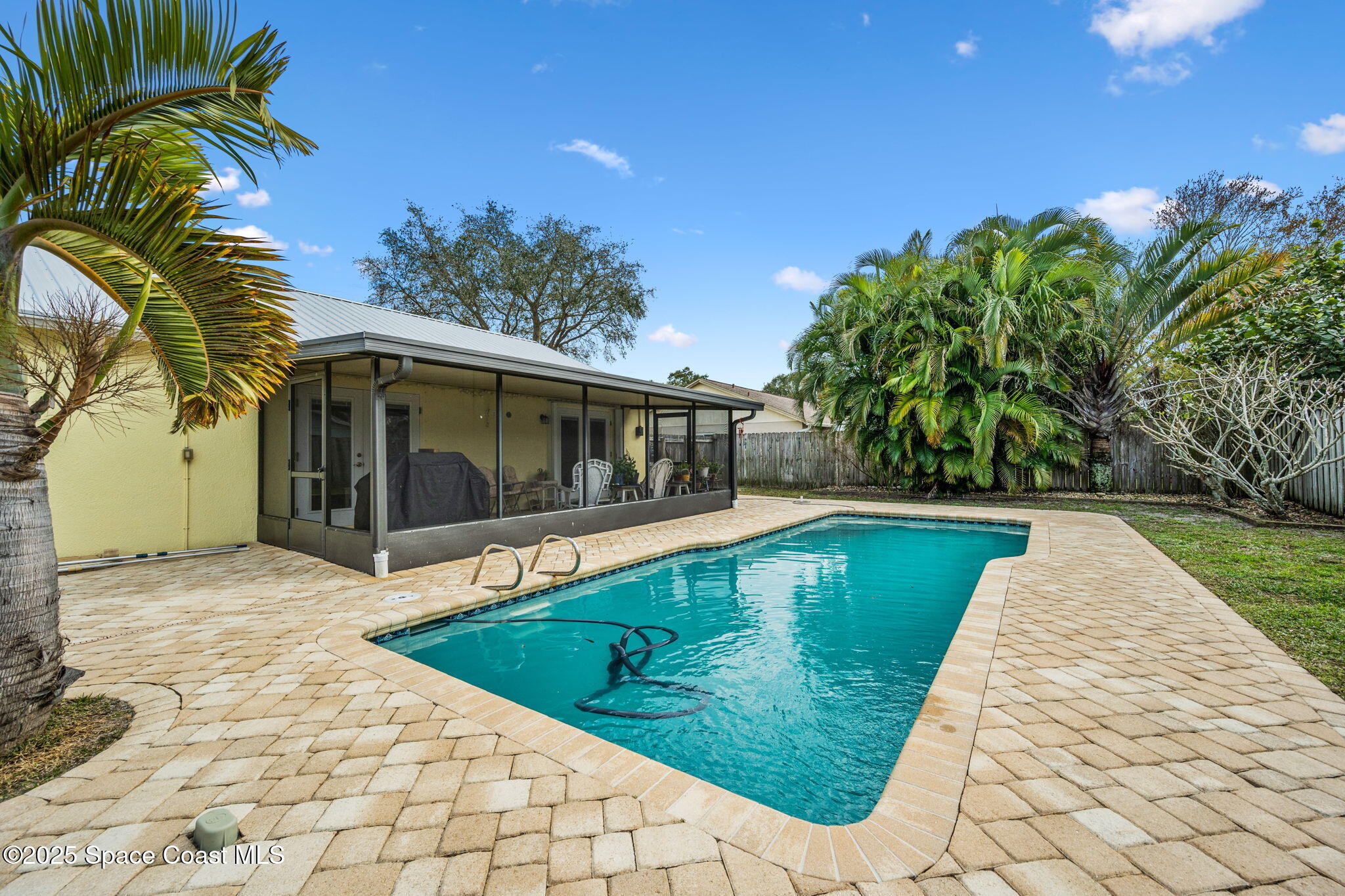 2568 Longwood Boulevard Melbourne, FL 32934 - Photo 38 of 42 a view of swimming pool with a yard