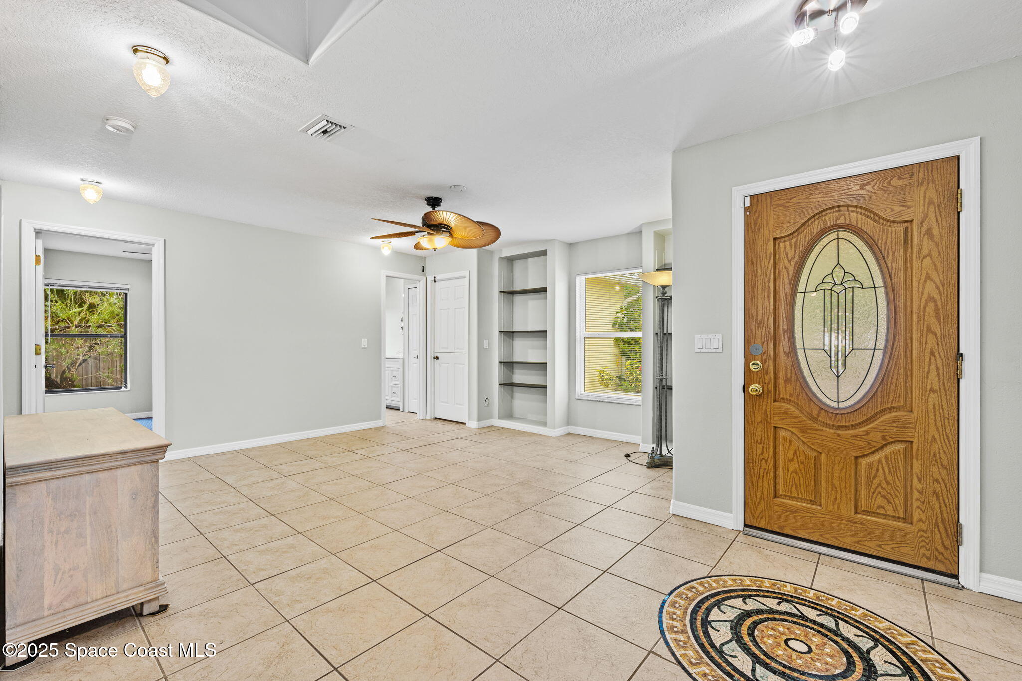 2568 Longwood Boulevard Melbourne, FL 32934 - Photo 10 of 42 a view of empty room with wooden floor